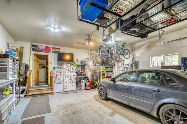 a view of parking garage with cars