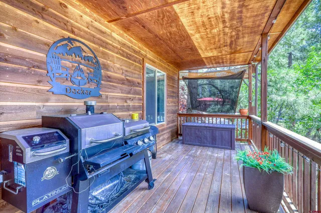 a view of a room with furniture and wooden floor