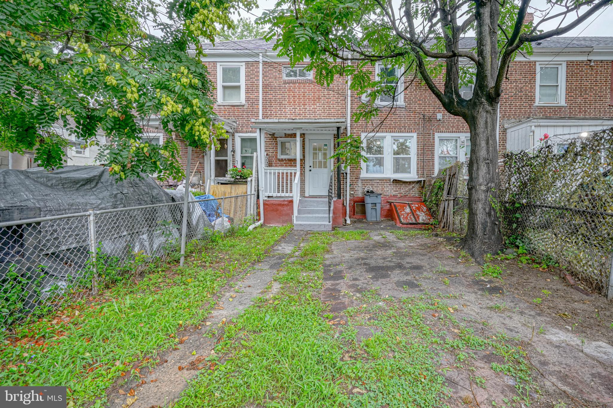 1662 Minnesota Road Camden, NJ 08104 - Photo 19 of 22 a front view of a house with a yard and trampoline
