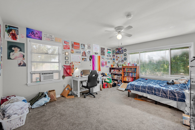 1275 North Geneva Road Provo, UT 84601 - Photo 7 of 25 Carpeted interior room featuring light gray walls, white trim, and a white ceiling fan with integrated lighting