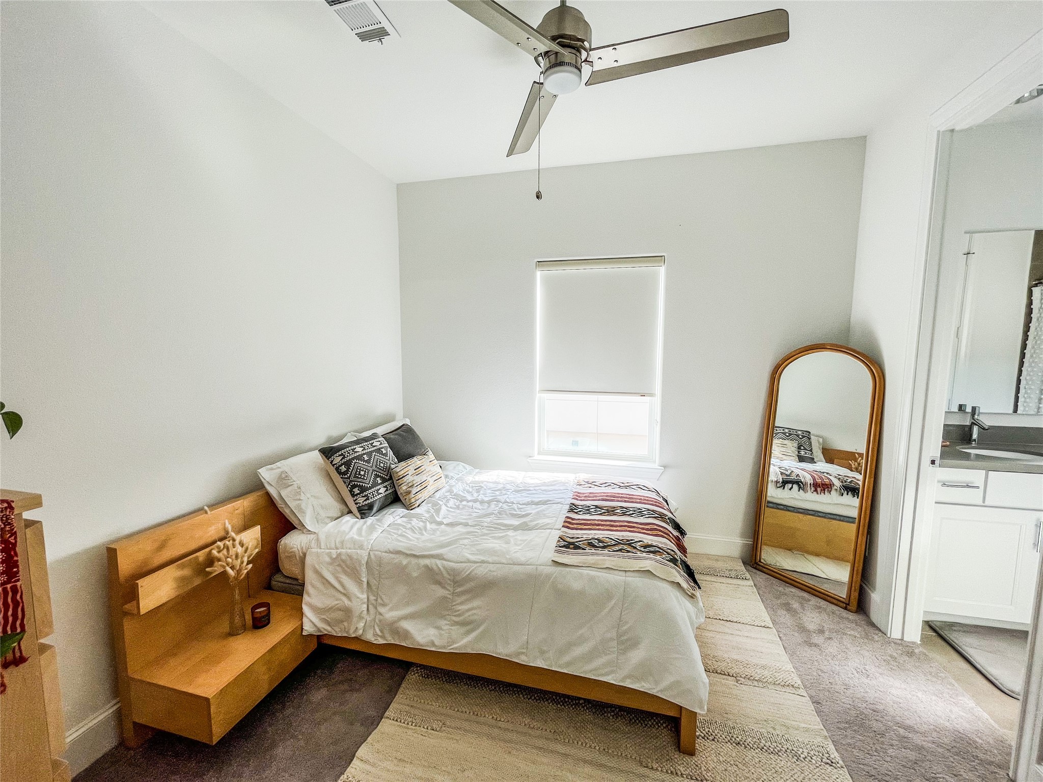 2024 Waterloo Station Road Houston, TX 77045 - Photo 10 of 14 Full size second bedroom located on the 3rd Floor with natural light, carpet and a full size private bathroom.
