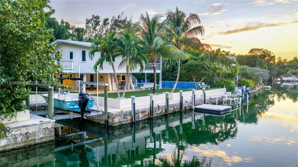 a balcony with table and chairs