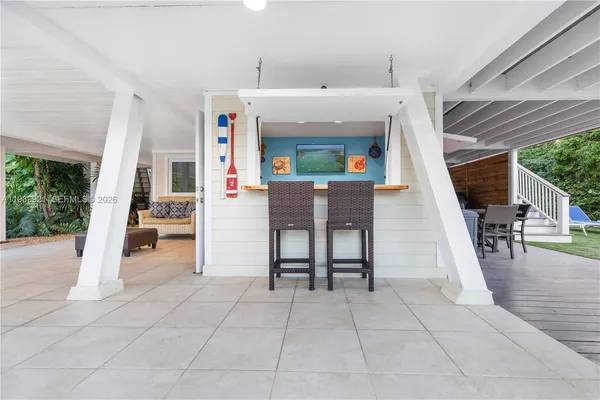 a view of livingroom with furniture and workspace