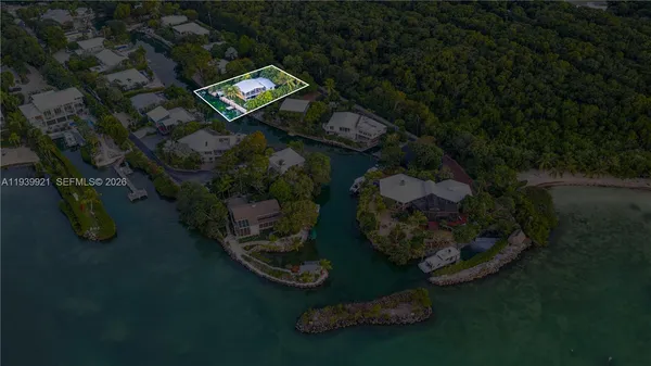 an aerial view of residential houses with outdoor space and street view