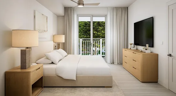 a bedroom with a bed and a flat screen television