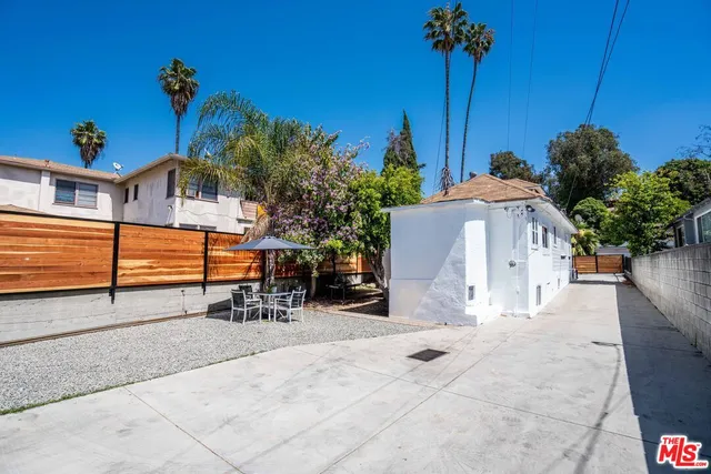 a front view of a house with sitting area