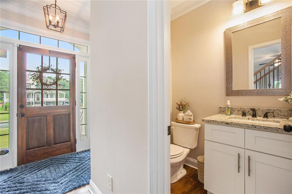 92 River Walk Parkway Euharlee, GA 30145 - Photo 17 of 53 a en suite bathroom with a granite countertop sink and a mirror