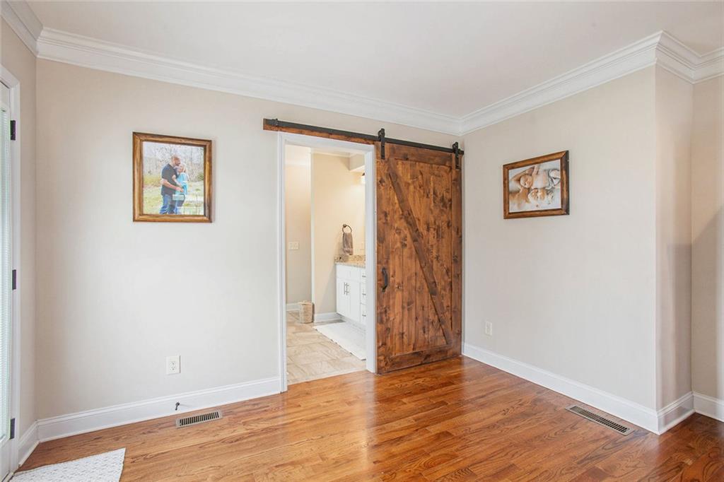 92 River Walk Parkway Euharlee, GA 30145 - Photo 22 of 53 a view of an empty room with wooden floor and a window