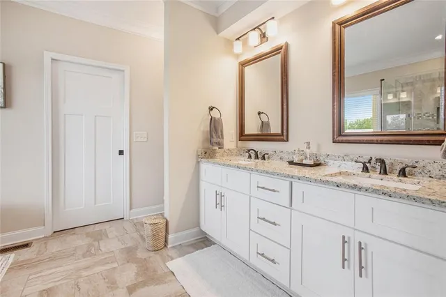 a bathroom with a tub shower and sink