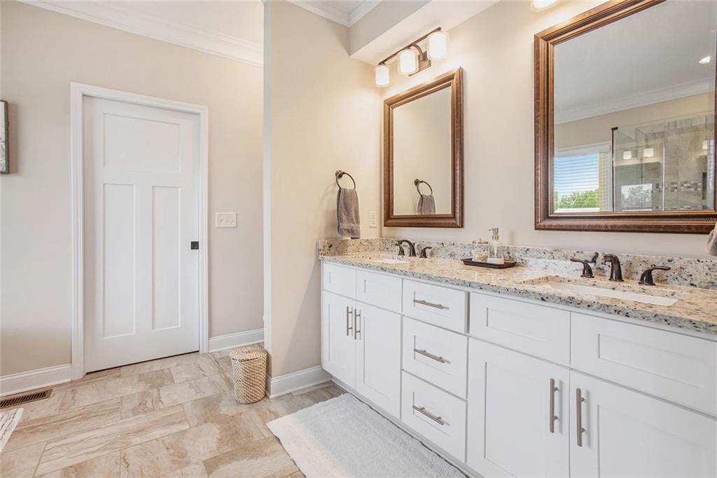 92 River Walk Parkway Euharlee, GA 30145 - Photo 23 of 53 a bathroom with double sink and a mirror