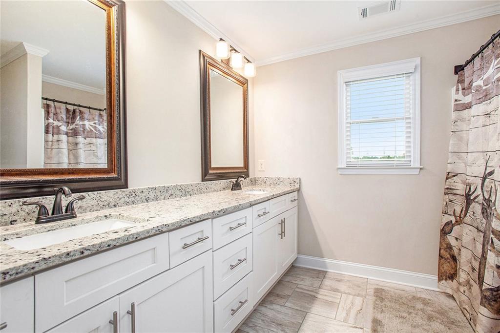 92 River Walk Parkway Euharlee, GA 30145 - Photo 28 of 53 a bathroom with a granite countertop sink mirror and a