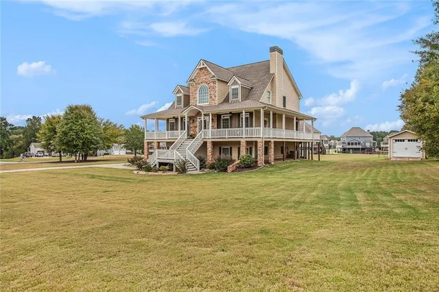 a view of a balcony with chair and wooden floor