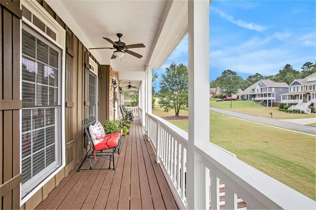 a view of a balcony with wooden floor