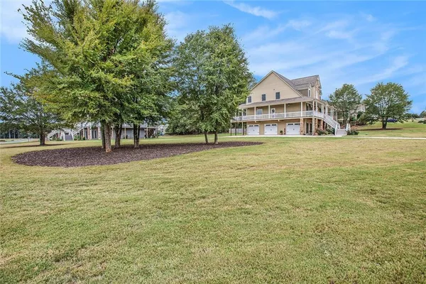 a view of a lake with a big yard