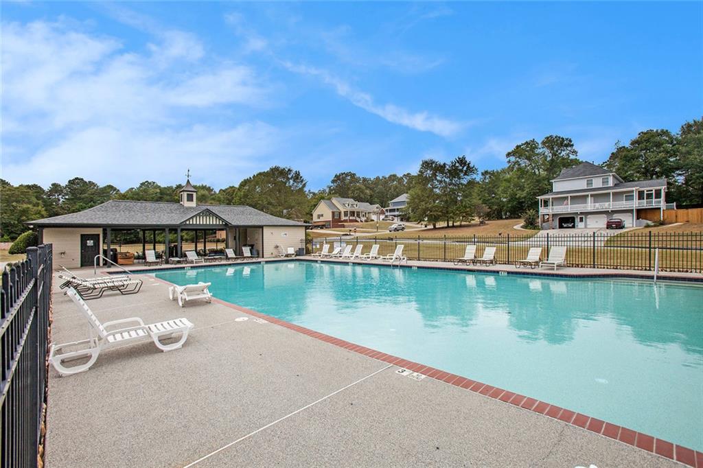 92 River Walk Parkway Euharlee, GA 30145 - Photo 40 of 53 a view of a lake with couches in the patio