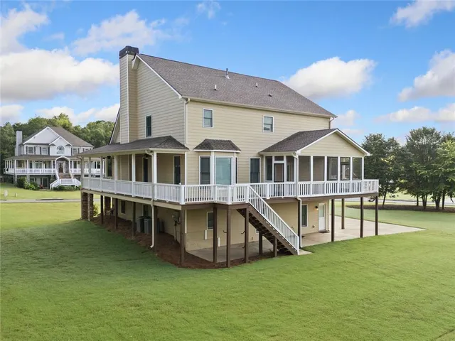 a front view of a house with a yard table and chairs