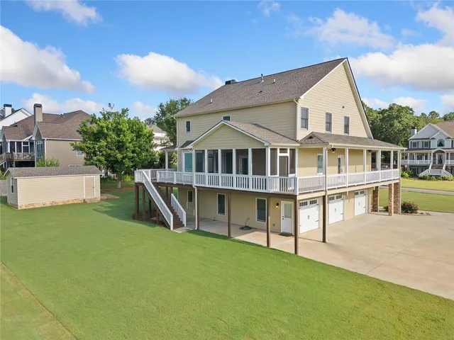 an aerial view of residential house with outdoor space and swimming pool