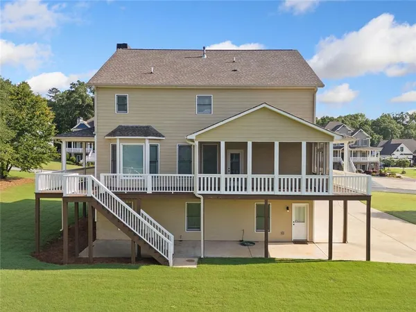 an aerial view of a house with a ocean view