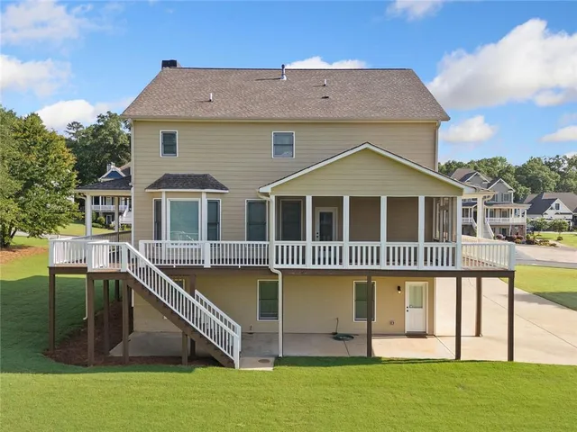 an aerial view of a house with a ocean view