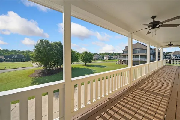 a view of a balcony with wooden floor