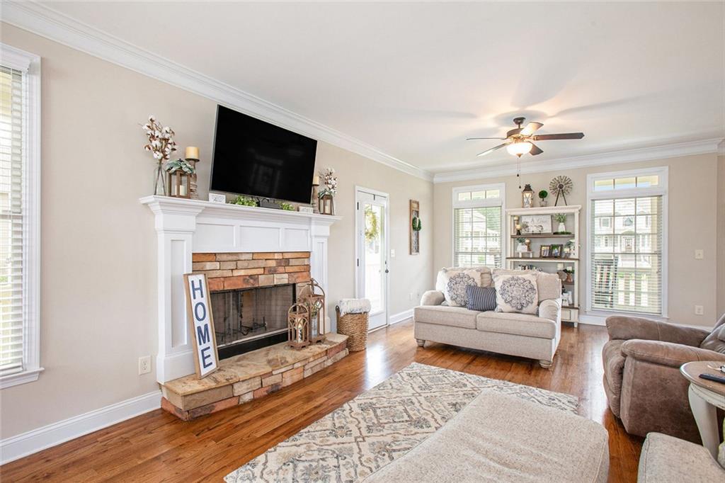 92 River Walk Parkway Euharlee, GA 30145 - Photo 8 of 53 a living room with furniture a flat screen tv and a fireplace