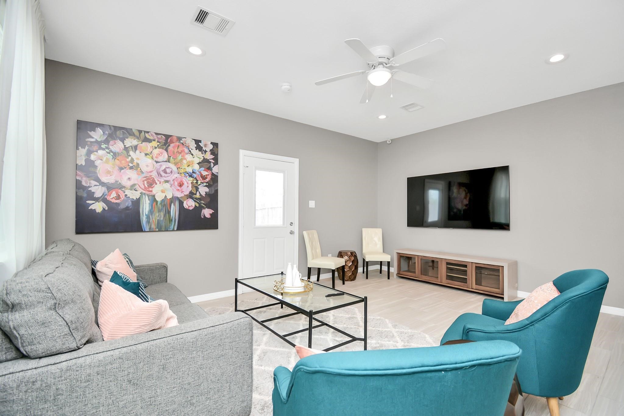 3019 Elysian Street Houston, TX 77009 - Photo 11 of 33 a living room with furniture and a flat screen tv