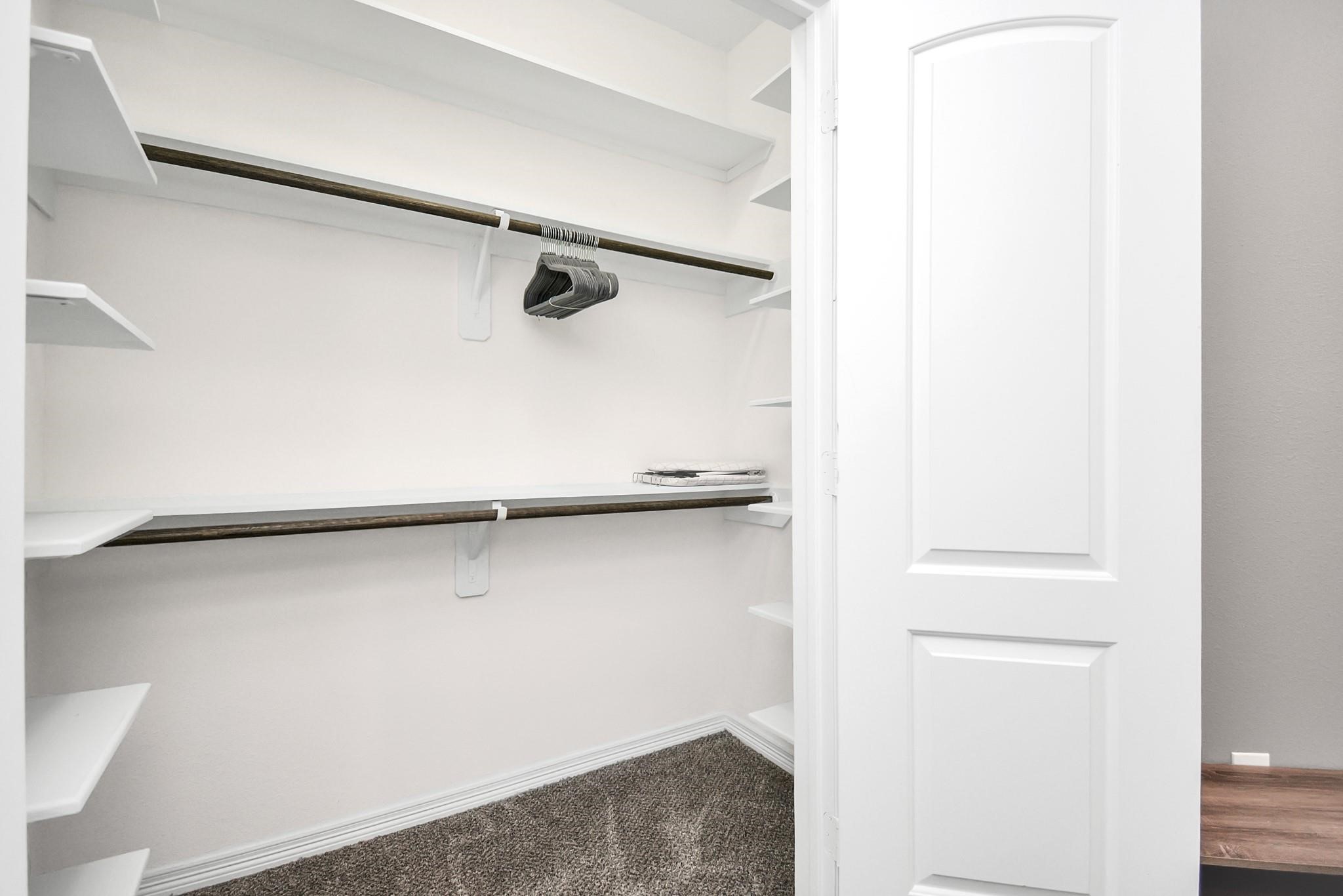 3019 Elysian Street Houston, TX 77009 - Photo 17 of 33 a view of walk in closet with empty racks