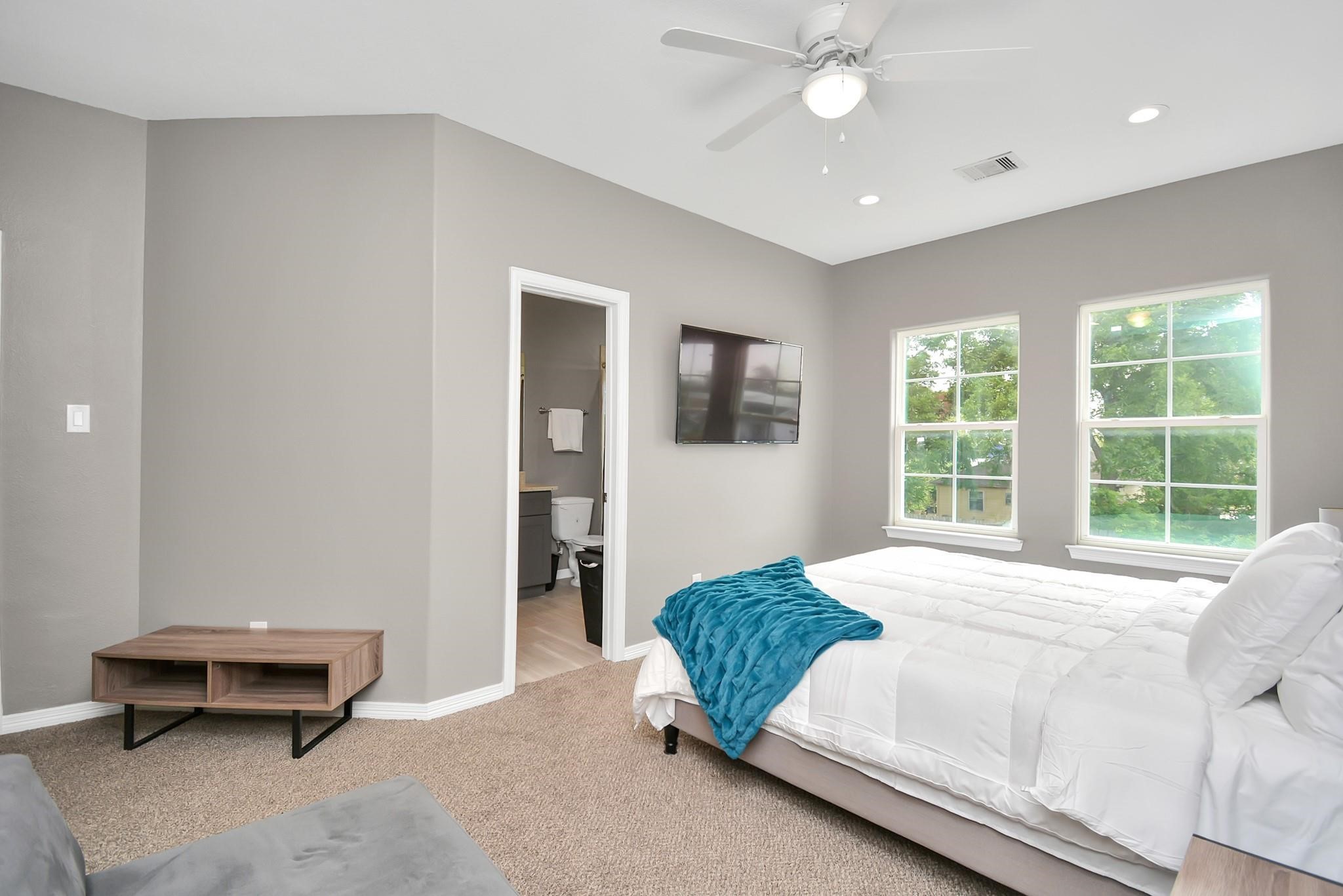 3019 Elysian Street Houston, TX 77009 - Photo 18 of 33 a spacious bedroom with a bed and a large window