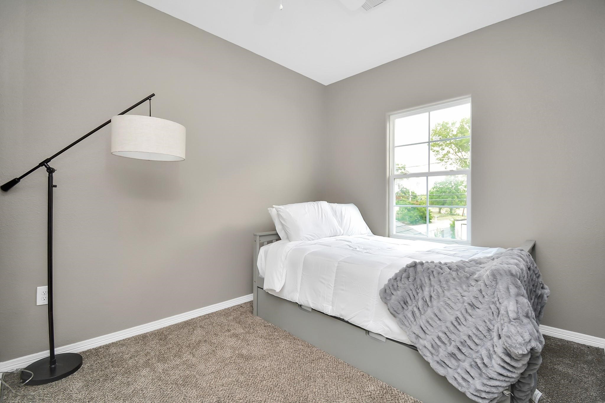 3019 Elysian Street Houston, TX 77009 - Photo 27 of 33 a bedroom with a bed and a window