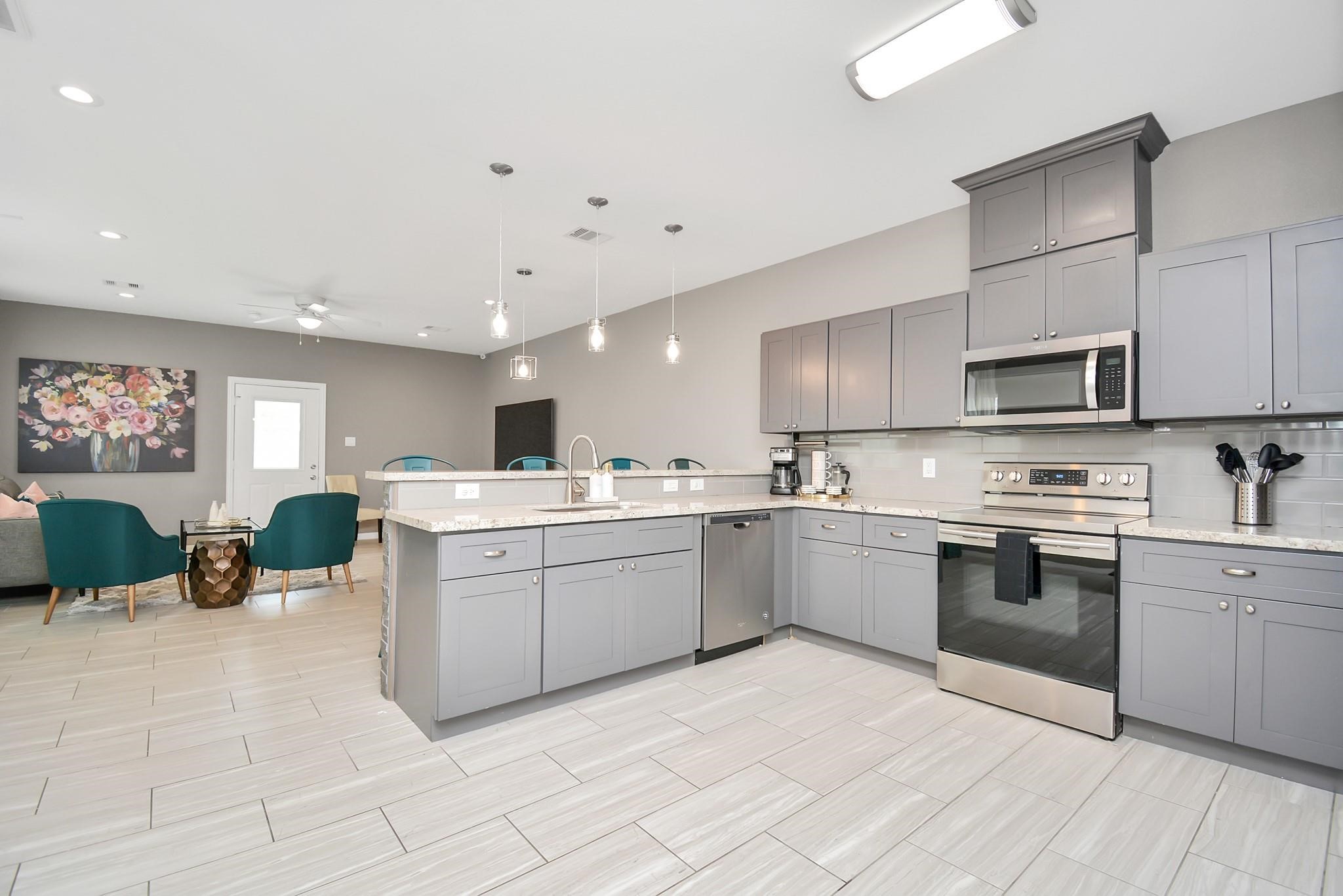 3019 Elysian Street Houston, TX 77009 - Photo 6 of 33 a kitchen with a sink stainless steel appliances and cabinets