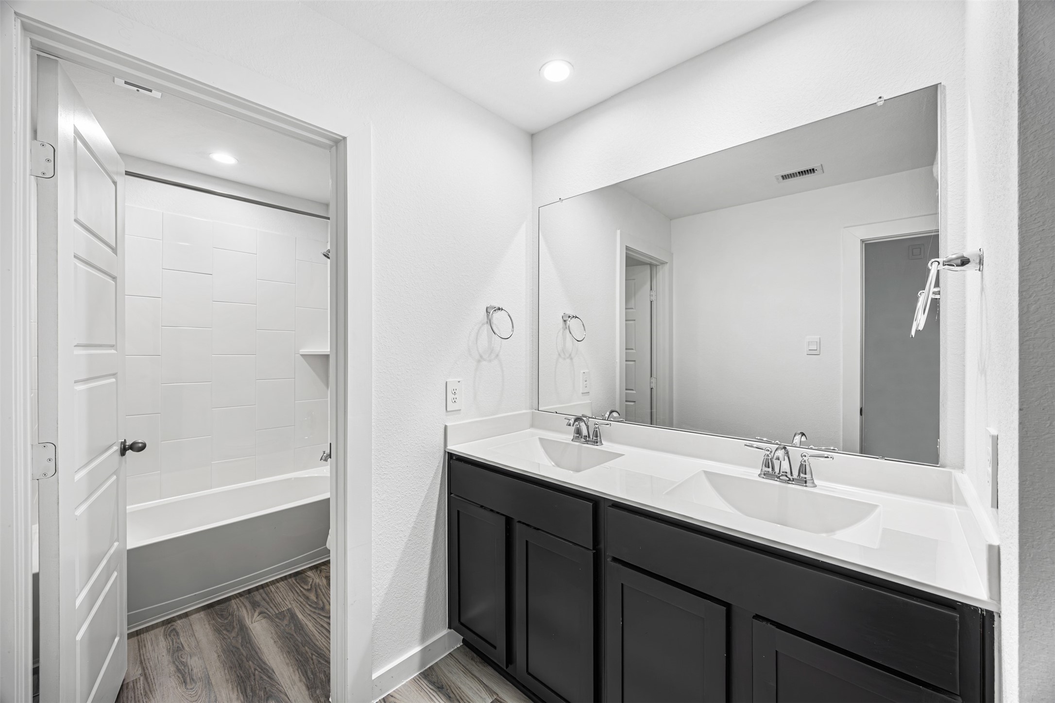 12305 Brandenburg Gate Road Houston, TX 77047 - Photo 16 of 22 a bathroom with a double vanity sink mirror double and shower