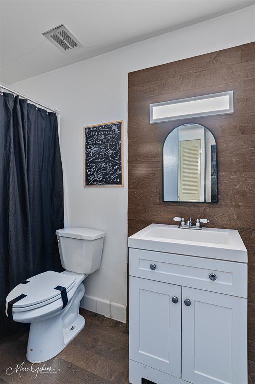 3304 Gorton Road Shreveport, LA 71119 - Photo 17 of 21 a bathroom with a toilet sink and mirror