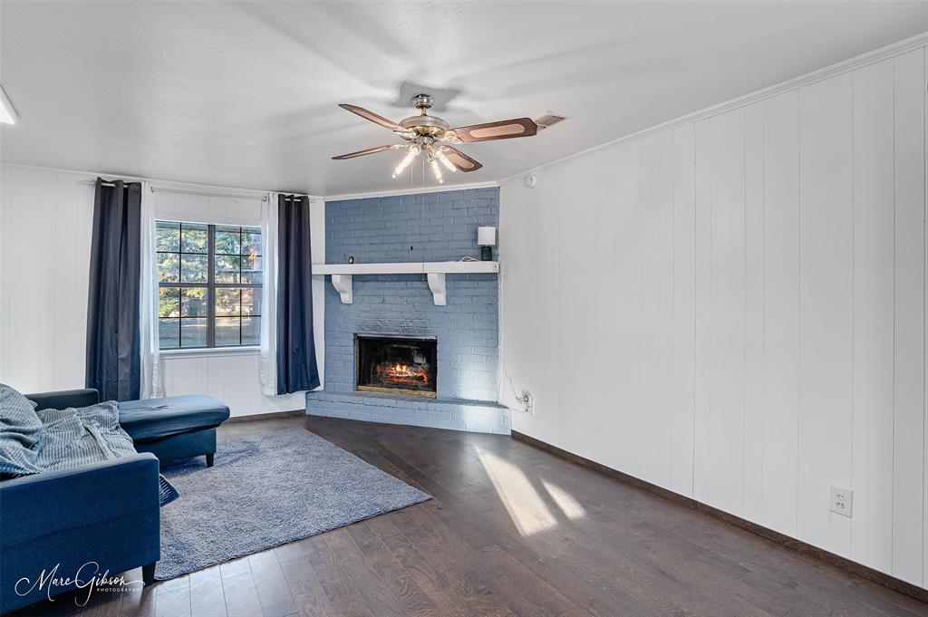 3304 Gorton Road Shreveport, LA 71119 - Photo 6 of 21 a living room with furniture and a fireplace