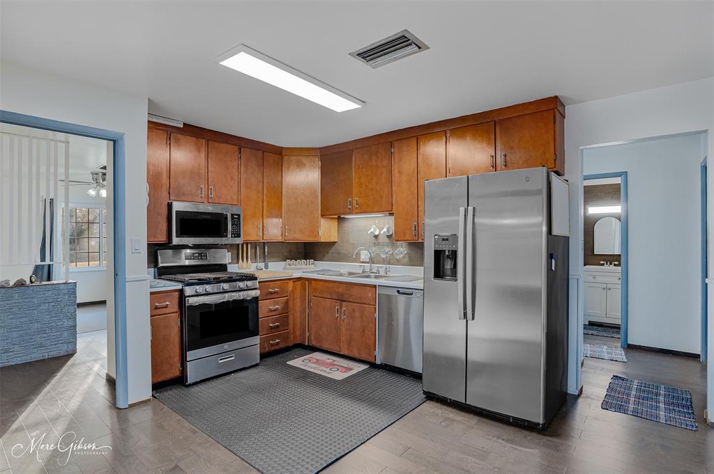 3304 Gorton Road Shreveport, LA 71119 - Photo 9 of 21 a kitchen with stainless steel appliances granite countertop a refrigerator a stove a sink and dishwasher