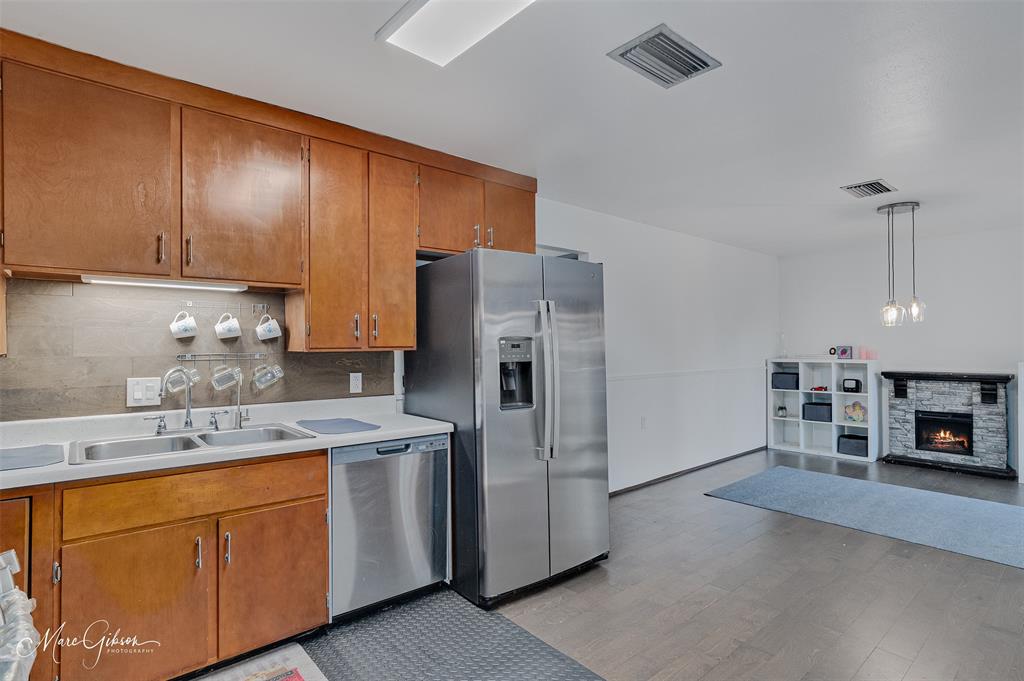 3304 Gorton Road Shreveport, LA 71119 - Photo 10 of 21 a kitchen with stainless steel appliances sink refrigerator and cabinets