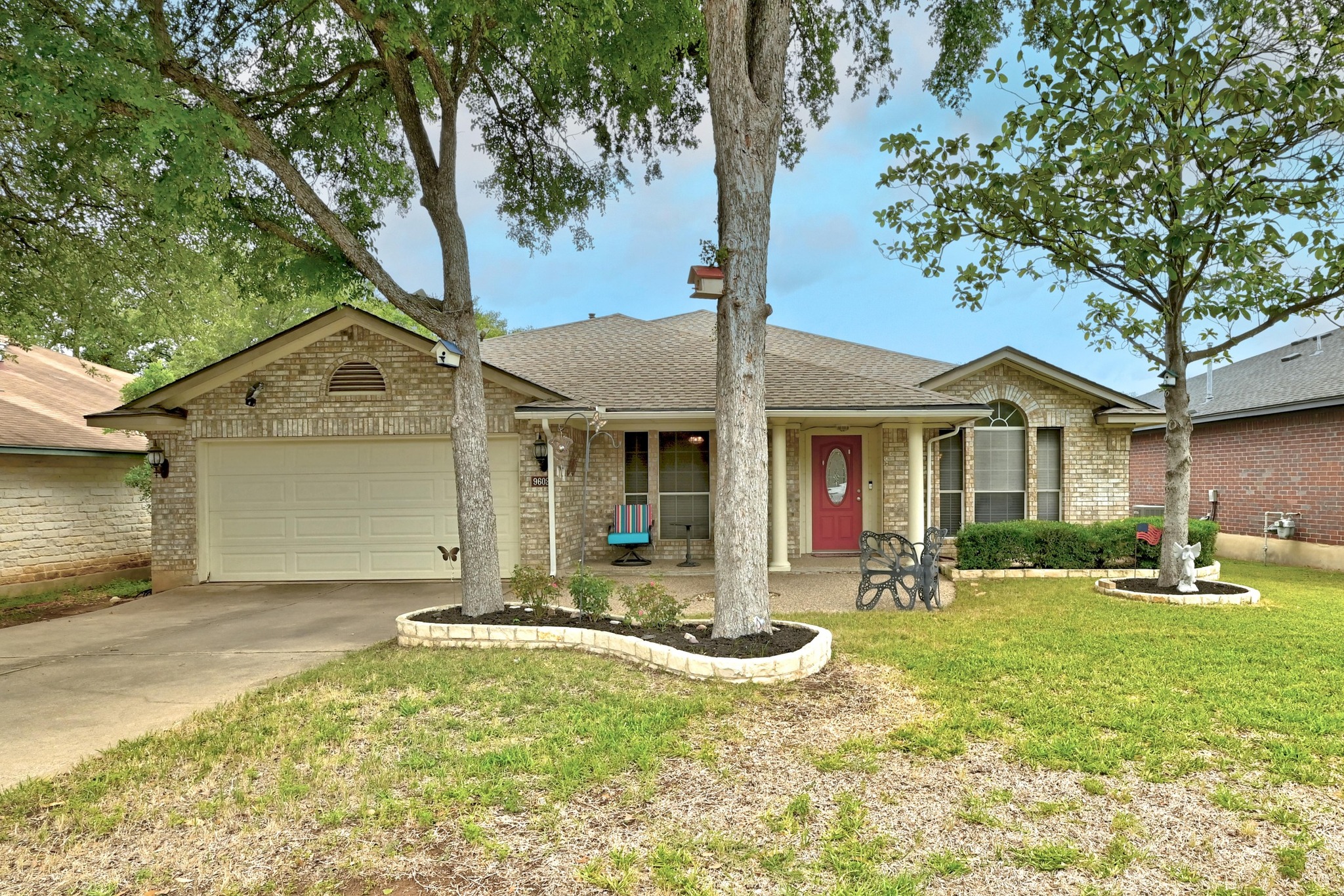 9602 Tea Rose Trail Austin, TX 78748 - Photo 1 of 27 Ranch-style house featuring a garage, brick siding, covered porch, and driveway