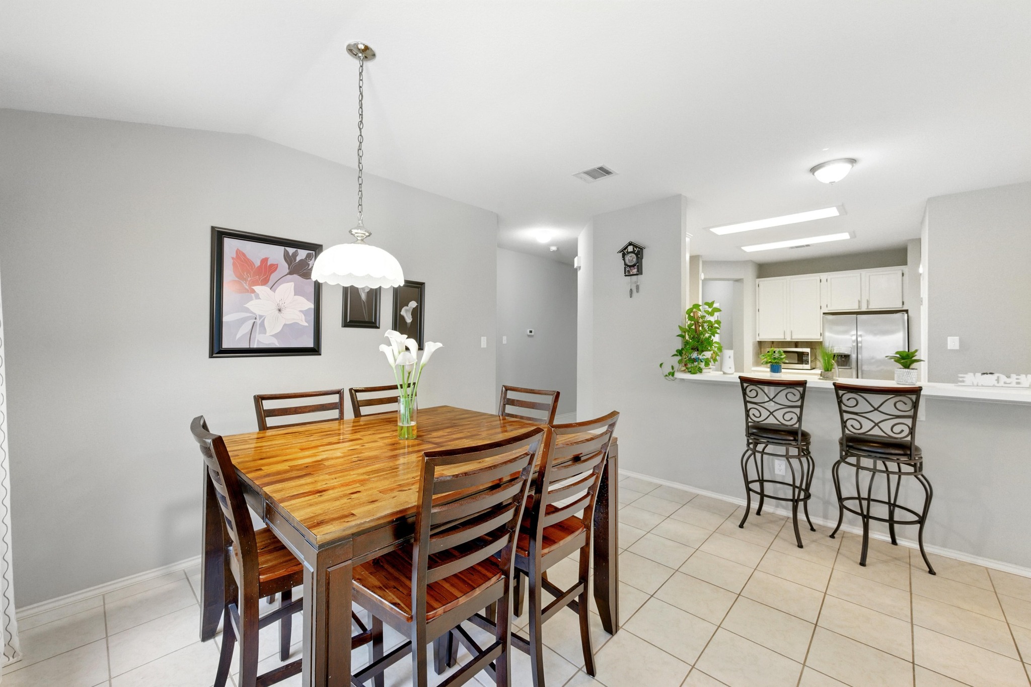 9602 Tea Rose Trail Austin, TX 78748 - Photo 15 of 27 Dining area featuring light tile patterned flooring and lofted ceiling