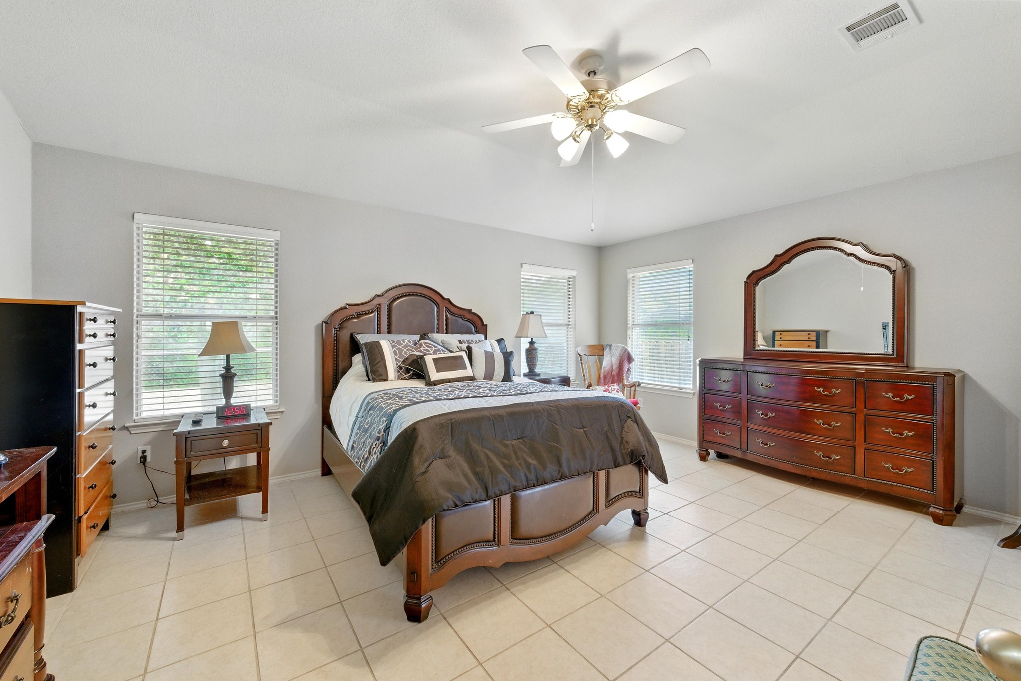 9602 Tea Rose Trail Austin, TX 78748 - Photo 16 of 27 Bedroom featuring ceiling fan and light tile patterned floors