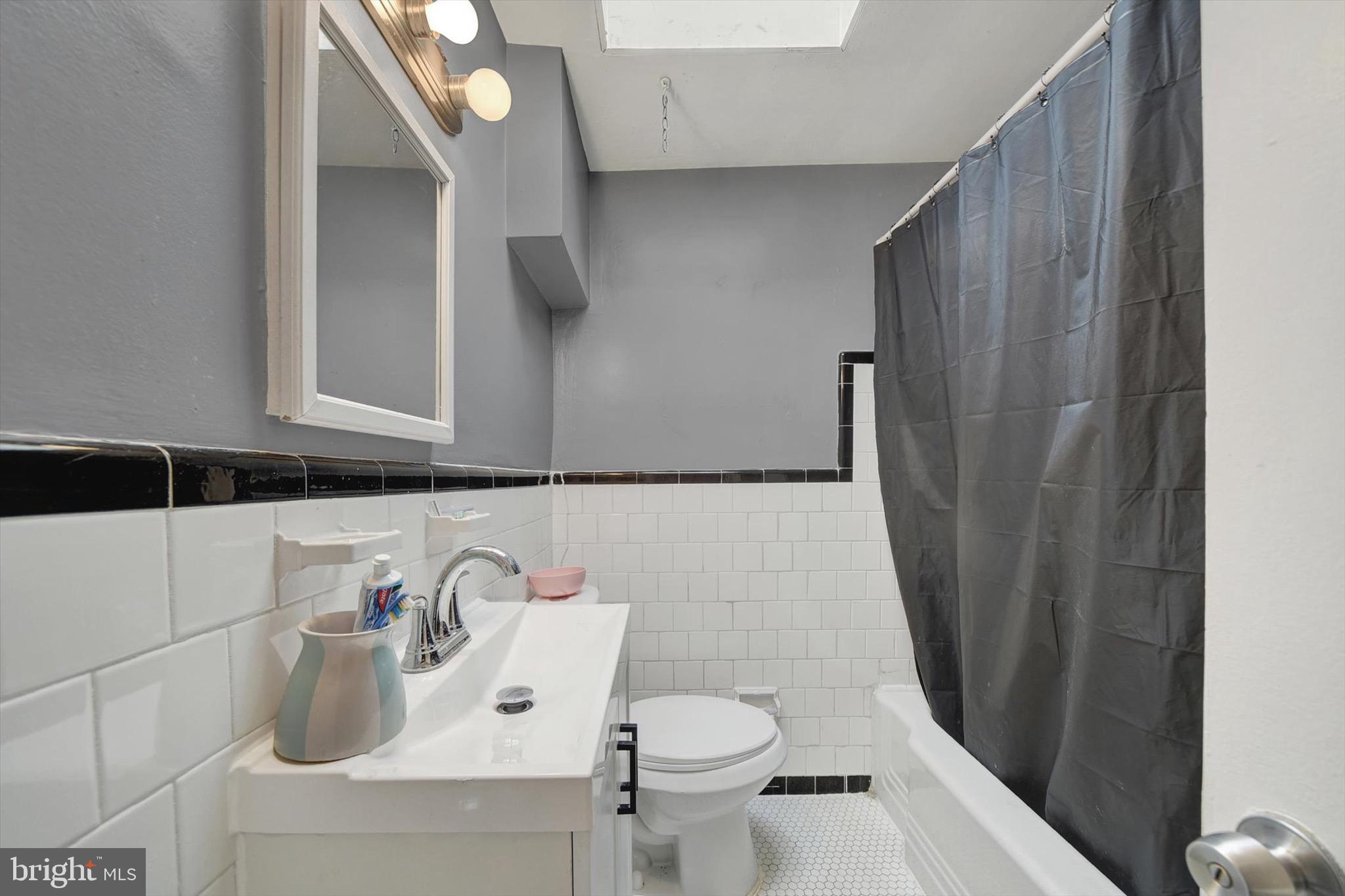 3552 Benzinger Road Baltimore, MD 21229 - Photo 13 of 23 a bathroom with a sink and a toilet