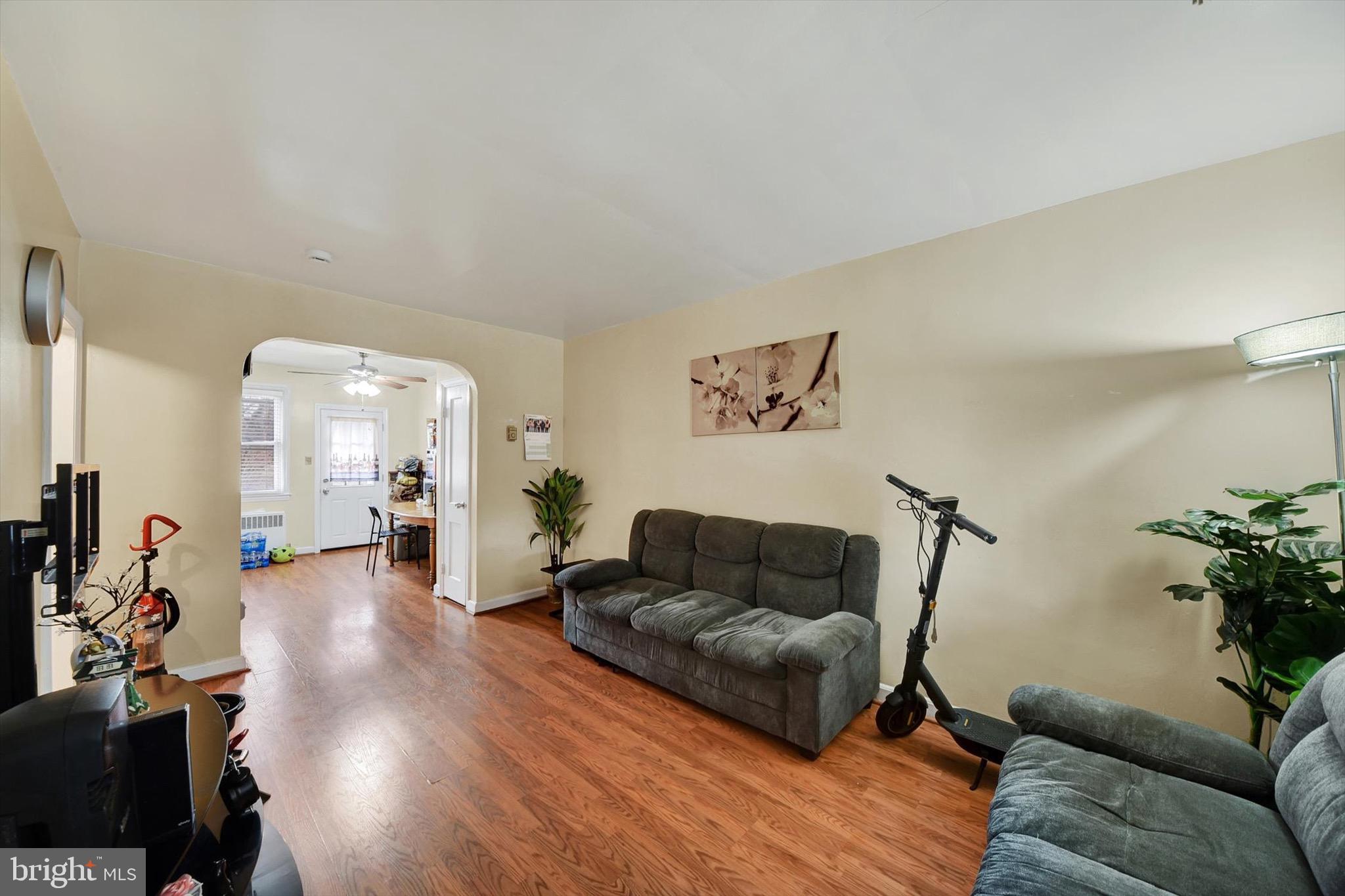 3552 Benzinger Road Baltimore, MD 21229 - Photo 4 of 23 a living room with furniture and wooden floor