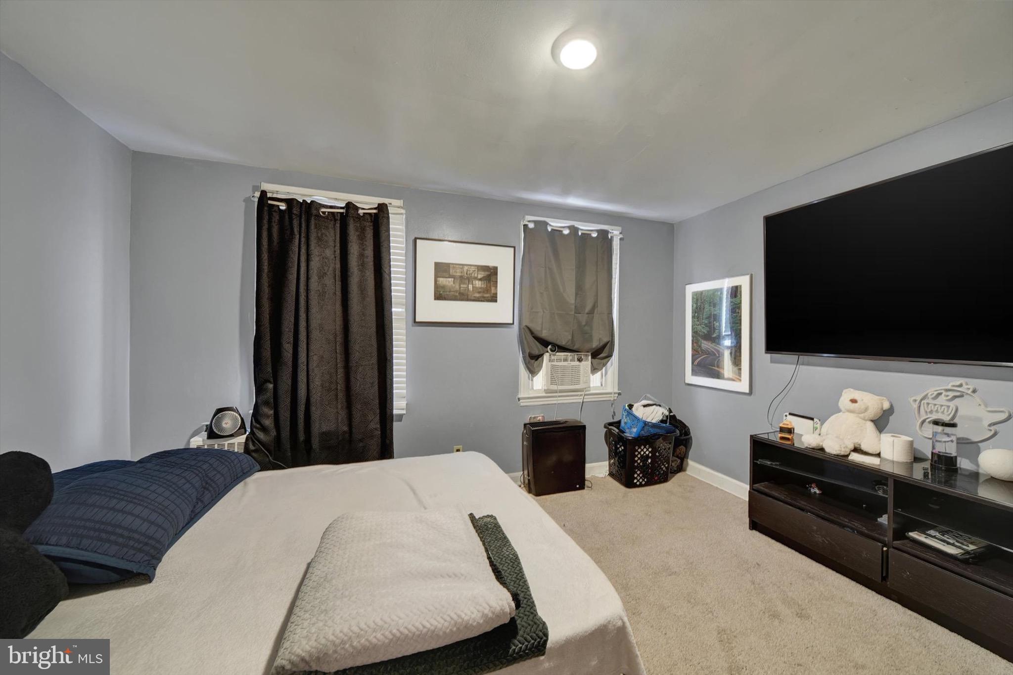 3552 Benzinger Road Baltimore, MD 21229 - Photo 9 of 23 a bedroom with a bed and tv