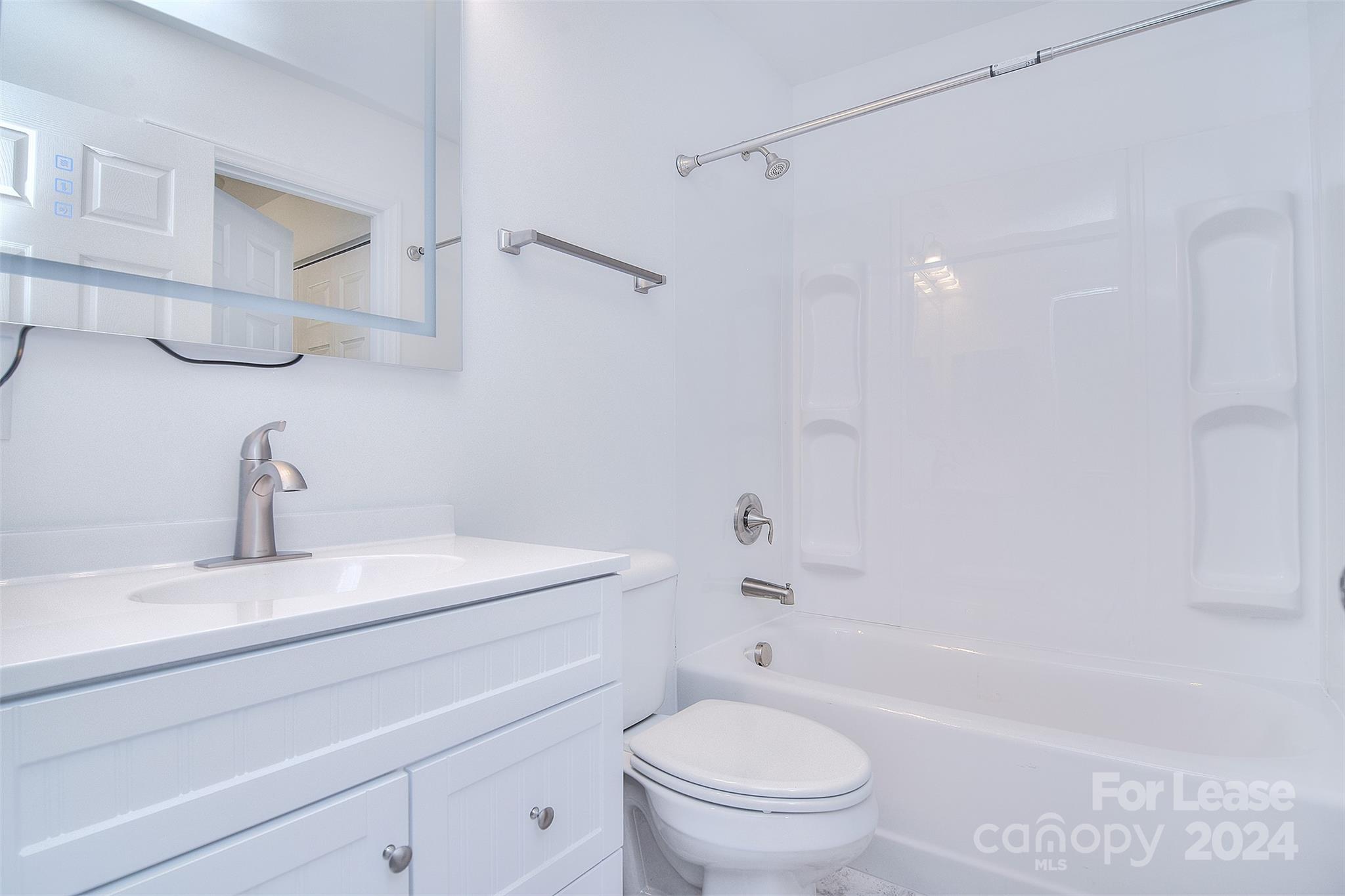 660 Lex Drive Charlotte, NC 28262 - Photo 14 of 16 a bathroom with a sink a toilet and a bathtub