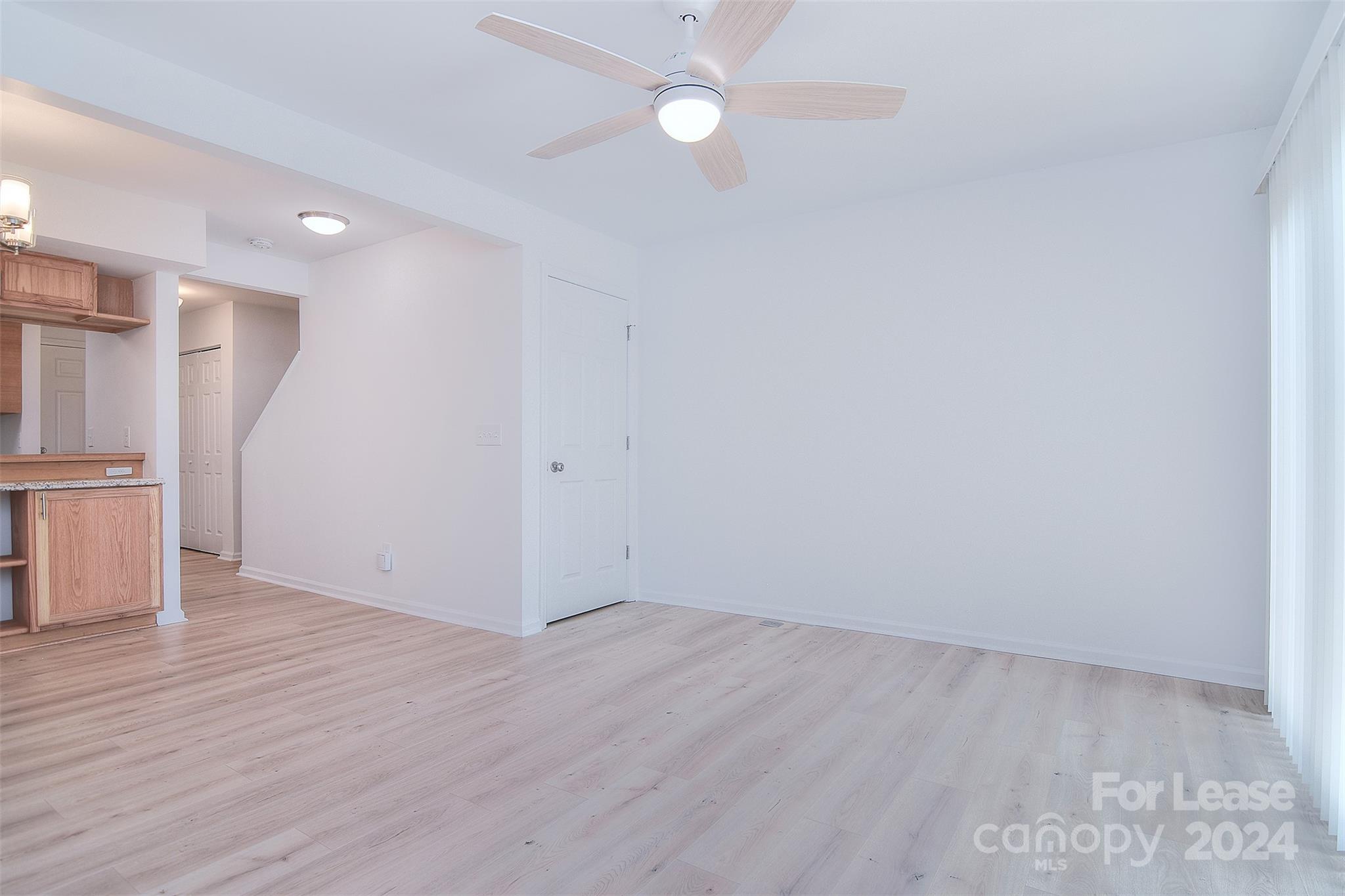 660 Lex Drive Charlotte, NC 28262 - Photo 2 of 16 a view of empty room with wooden floor