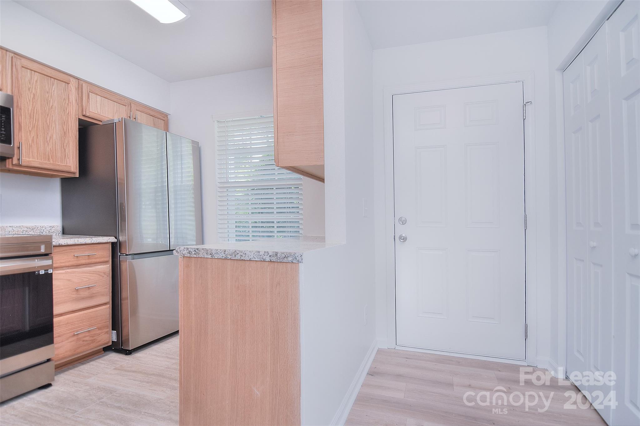 660 Lex Drive Charlotte, NC 28262 - Photo 6 of 16 a kitchen with a refrigerator stove and cabinets
