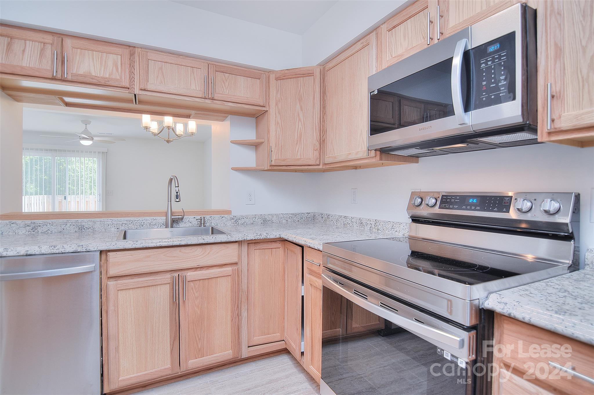 660 Lex Drive Charlotte, NC 28262 - Photo 8 of 16 a kitchen with appliances cabinets and a sink