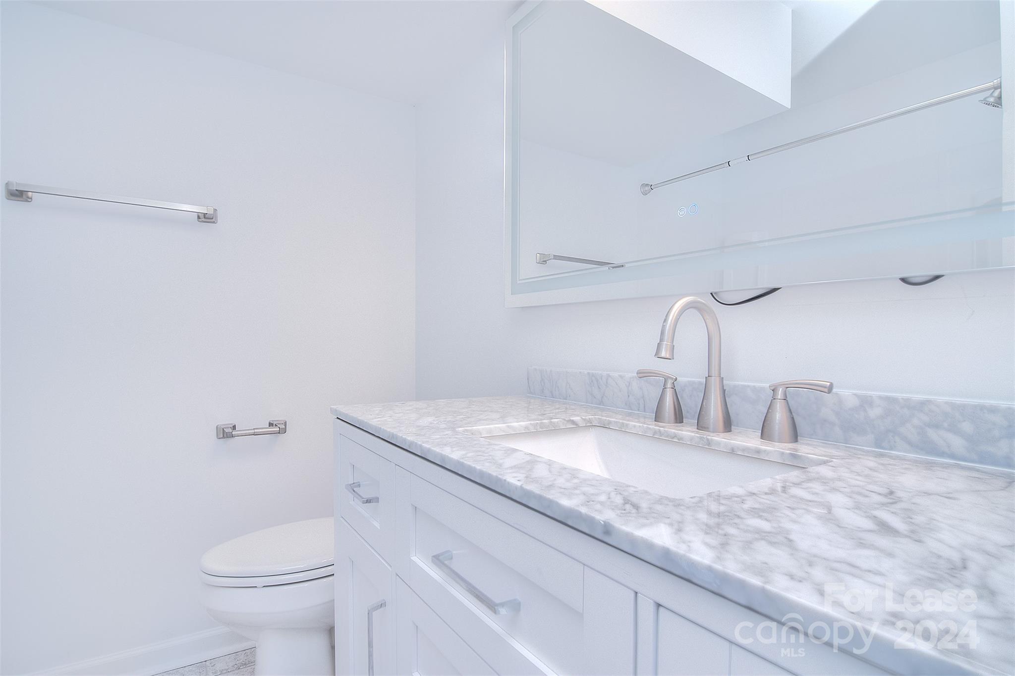 660 Lex Drive Charlotte, NC 28262 - Photo 10 of 16 a bathroom with a granite countertop sink and a toilet