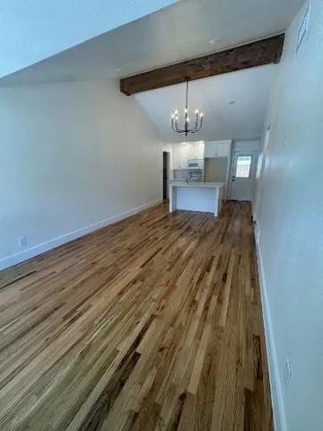 en empty room with wooden floor