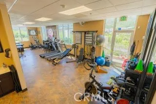 a hall way with furniture a washer and dryer