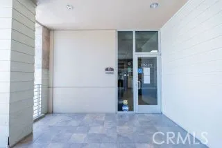 an empty room with large windows
