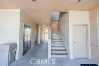 a view of a hallway with entryway wooden floor and front door